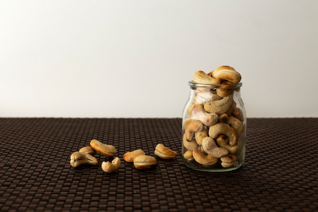 Cashew Nut, Healthy Seeds Glass jar with a white background