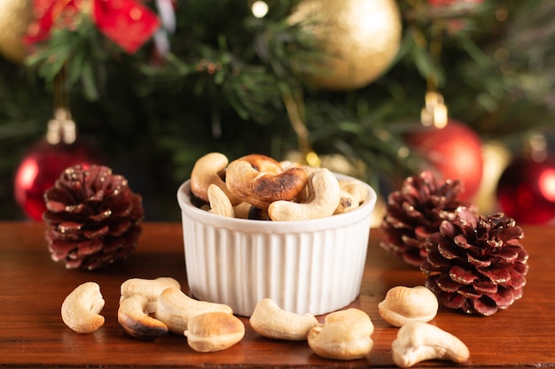 Cashew nut in a pot on a Christmas background