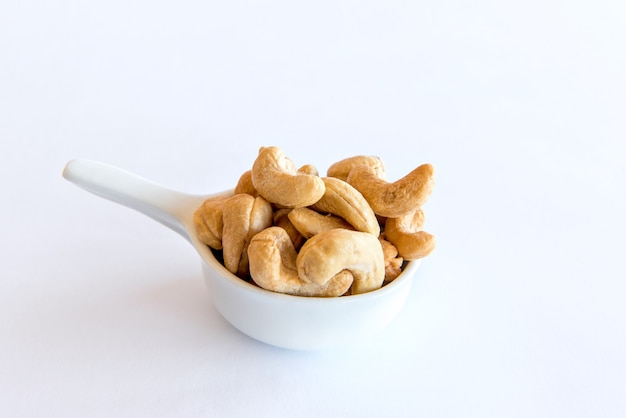 Cashew nut on white background. Healthy grains.
