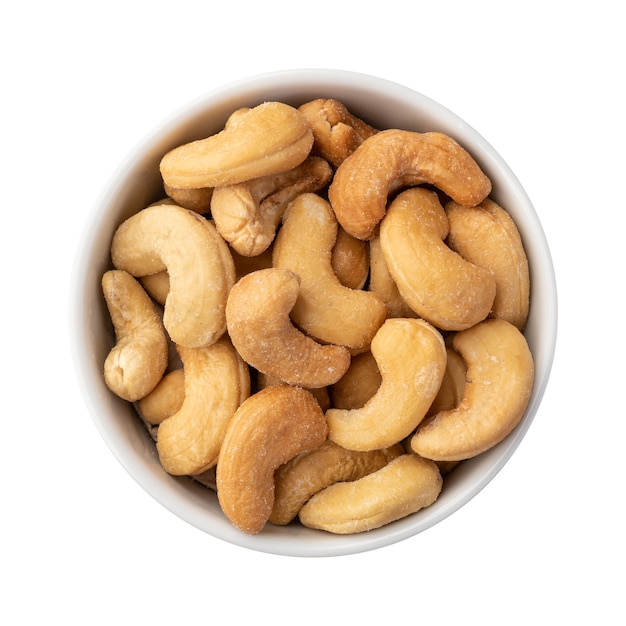 Cashew nuts in a bowl isolated over white background.