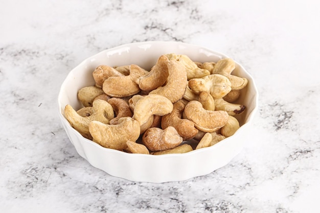 Cashew nuts heap in the bowl for snack