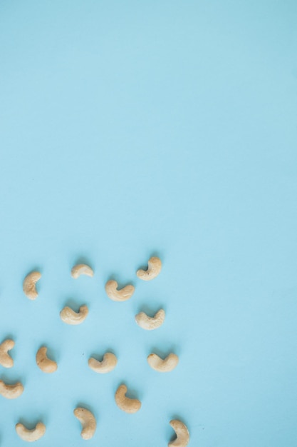 Cashew nuts isolated on blue background