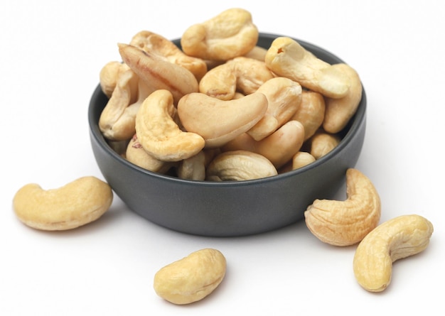 Cashew nuts roasted over white background