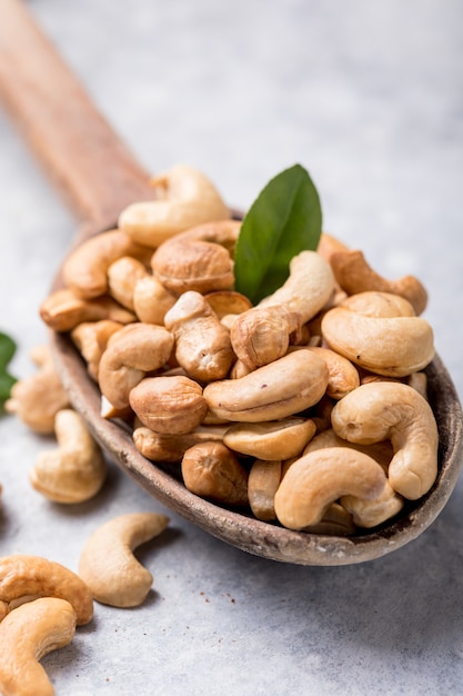 Cashew nuts in spoon top view