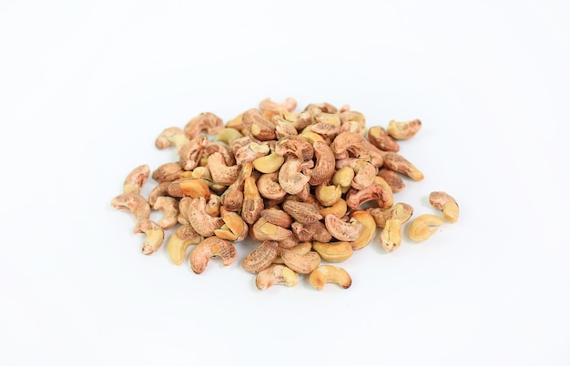 Cashew nuts with shell isolated on a white background