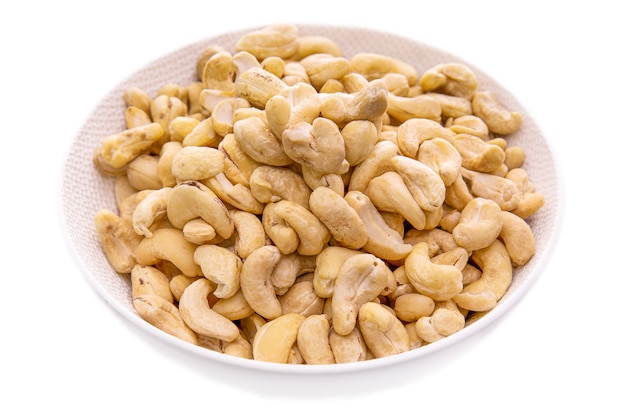 Cashews nuts in a white bowl closeupisolated food products