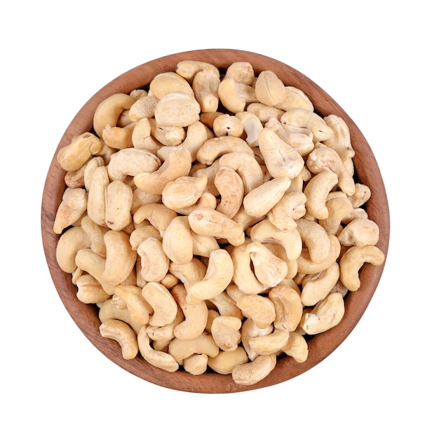 Cashews in a wooden bowl isolated on a white background