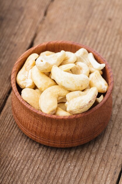 Cashews in a wooden bowl on the table