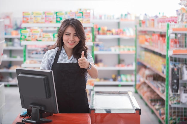 Cashier showing thumb up