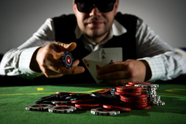 Casino chips on a background of a poker player