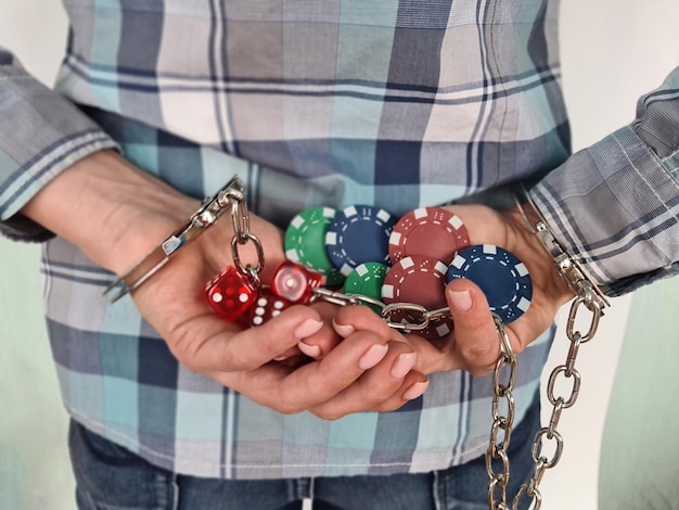 Casino chips dice and persons in handcuffs