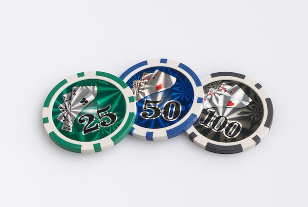 Photo casino chips on a white background. the concept of gambling and entertainment. casino and poker