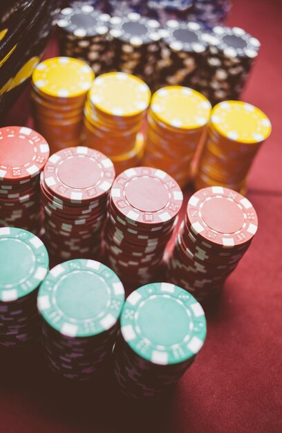 Casino colorful poker chips lie on the game table in the stack\
vintage photo processing