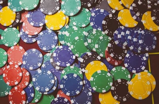 Photo casino colorful poker chips lie on the game table in the stack vintage photo processing