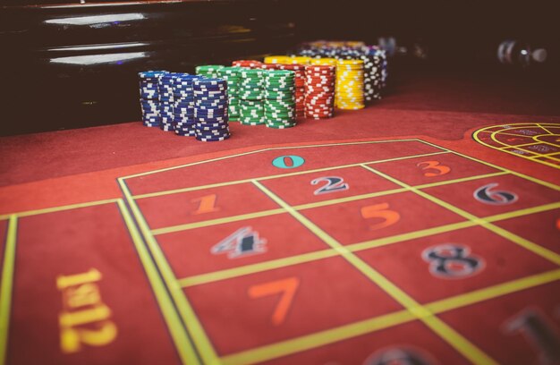 Casino colorful poker chips lie on the game table in the stack\
vintage photo processing