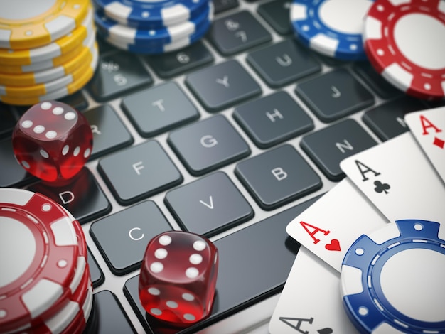 Casino online Gambling chips cards and dice on laptop computer background