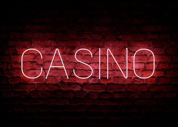 Segno del casinò di colore rosa neon testo su muro scuro in mattoni casinò online concetto di gioco d'azzardo illustrazione 3d