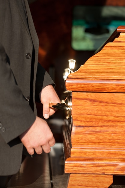 casket carried by coffin bearer