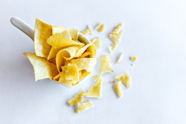 Cassava chips on white background.