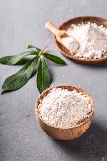 Cassava flour on grey background