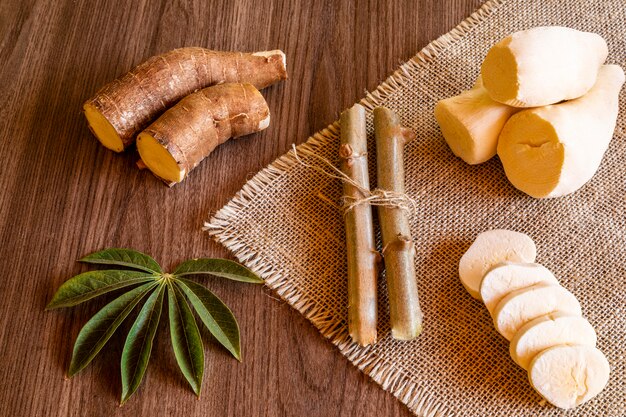 Cassava with ginger on a wooden table