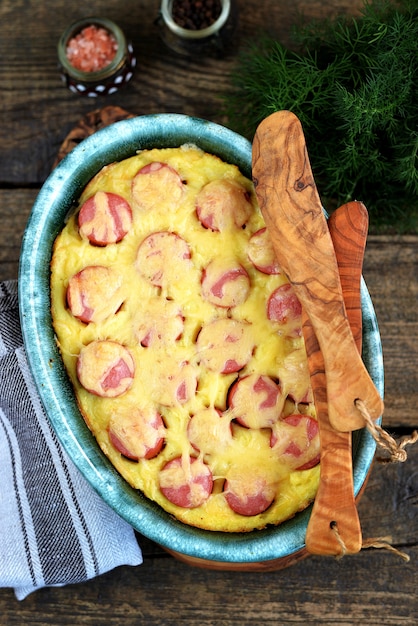 Casserole of mashed potatoes with sausages and cheese