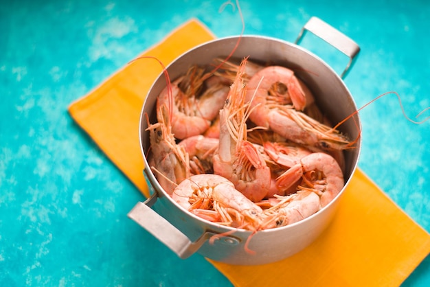 Casserole with shrimps on a bright yellow napkin