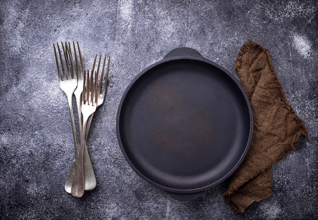 Cast iron frying pan with herbs and spices