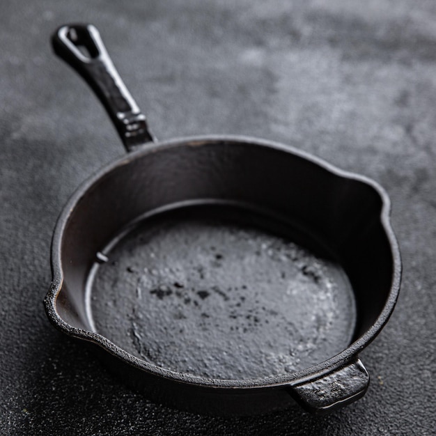 cast iron pan kitchen cooking equipment frying pan on the table dark background copy space food