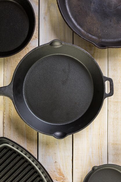 Cast iron skillet on rustic wood table.