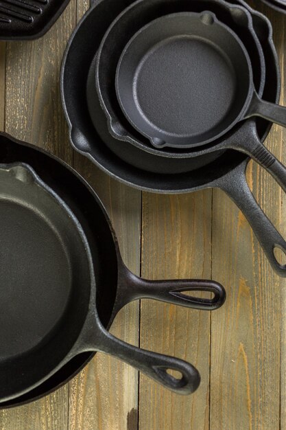 Cast iron skillet on rustic wood table.