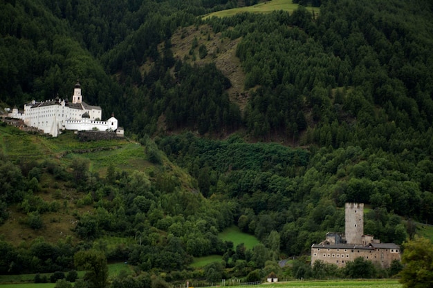 Castel Principe and Marienberg Abbey or Abtei Marienberg or Abbazia Monte Maria on mountain at Malles Venosta in val Venosta in TrentinoAlto Adige Italy