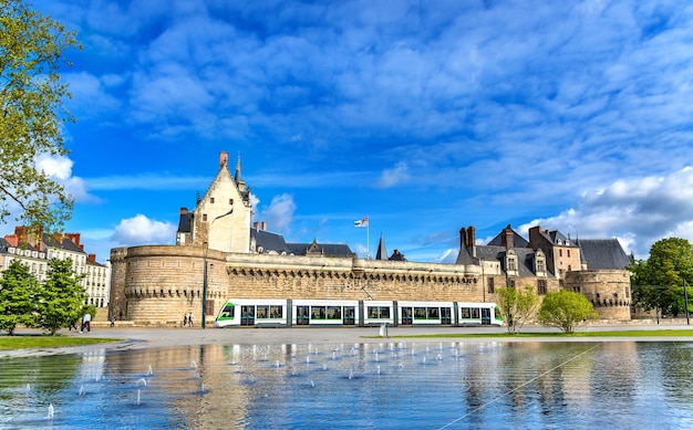 Castle of the Dukes of Brittany and a tram in Nantes France