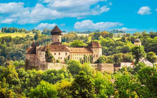 Castle Sovinec Eulenburg robust medieval fortress one of the largest in Moravia Czech republic landscape with medieval castle on a rocky hill above a forest valley