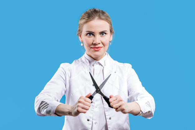 Photo castration circumcision a female doctor holds scissors in her hands veterinarian hospital treatment