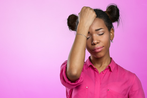 Casual black woman with headache