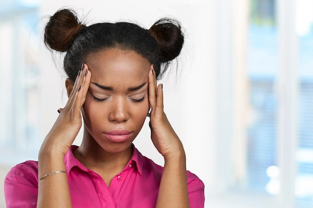 Casual black woman with headache
