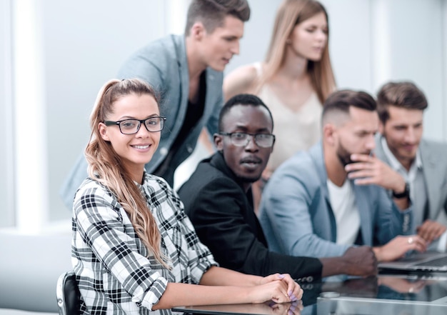 Casual business team listening during meeting in the office