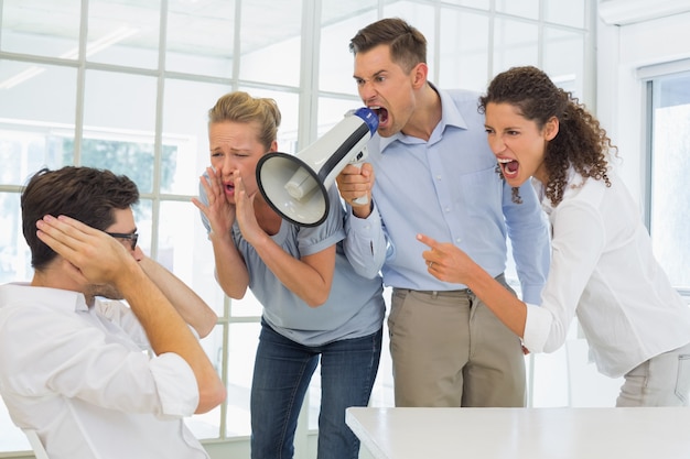 Photo casual business team shouting at a colleague