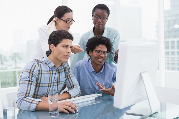 Casual business team working together at desk