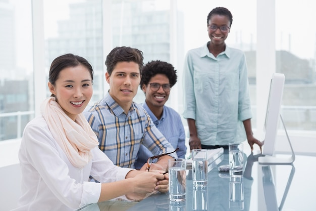 Casual business team working together at desk