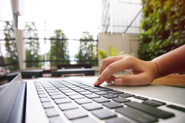 The Casual business woman works Hand typing on laptop keyboard