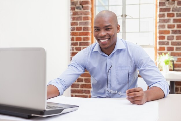 Casual businessman smiling at camera