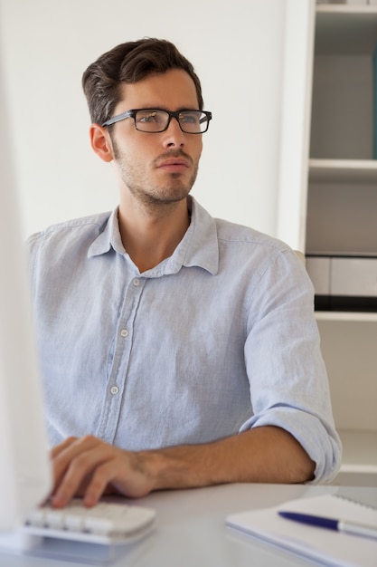 Casual businessman working at his desk