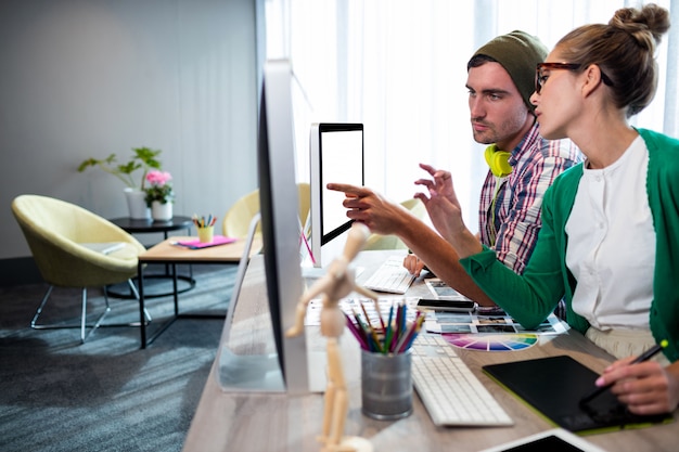 Casual colleagues using computer