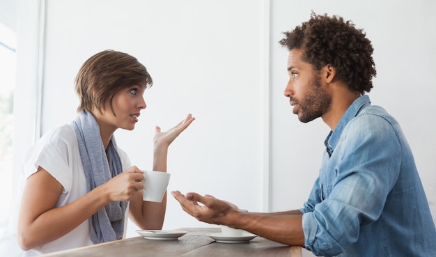 Casual couple having coffee together