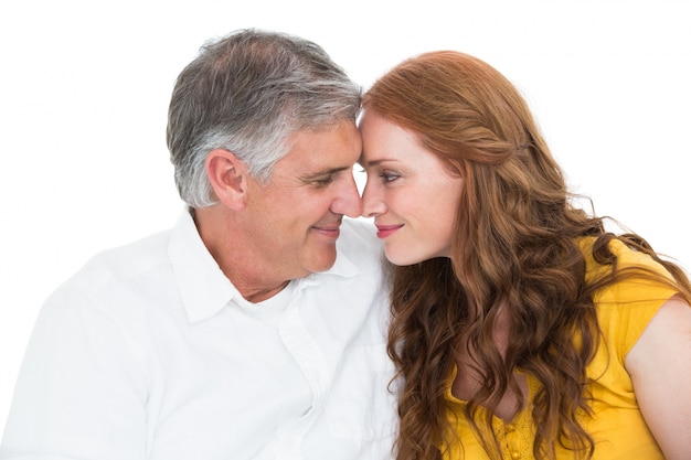 Casual couple smiling at each other