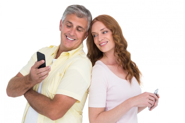 Casual couples on their phones on white background