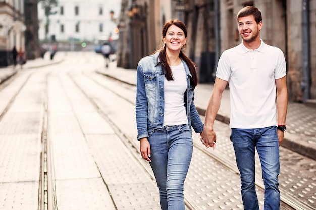 Casual cute couple walking through the city