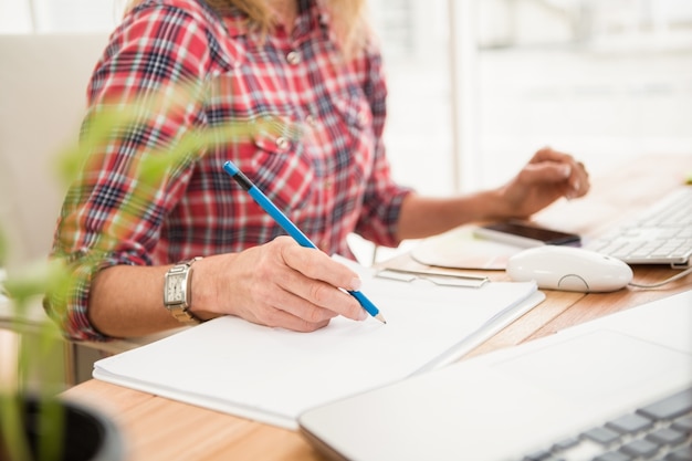 casual designer designing on working desk